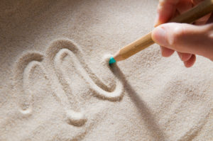 Im Sand schreiben